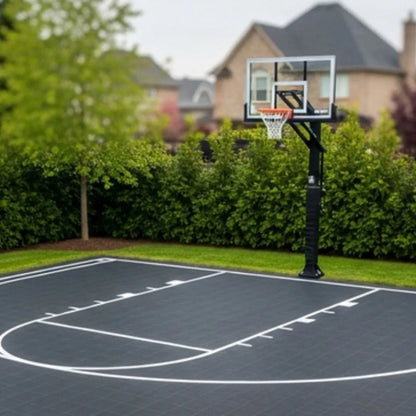 Modular Court Systems outdoor basketball court with durable, weather-resistant tiles and adjustable hoop in a residential ...